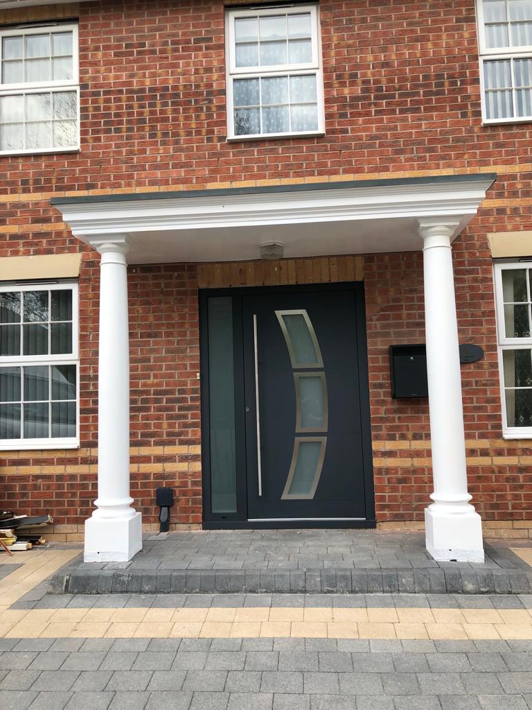 Grey composite front door with glazed side panel – Inspired Glazing