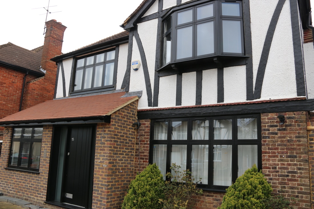 Slim black-framed windows on a mock-Tudor house – Inspired Glazing, windows and doors in Orpington